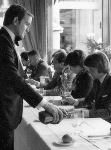 a group of people sitting at a table