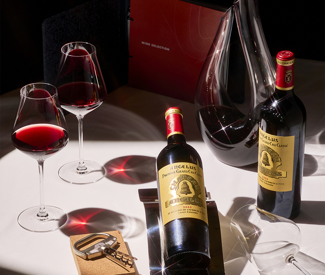 a table with wine glasses and bottles