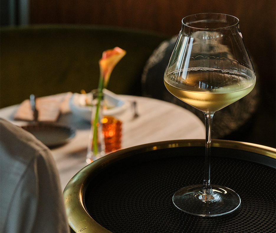 a glass of wine on a table