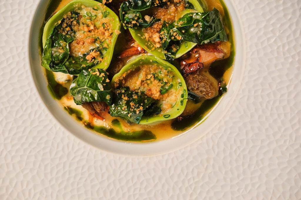 a bowl of food on a white plate