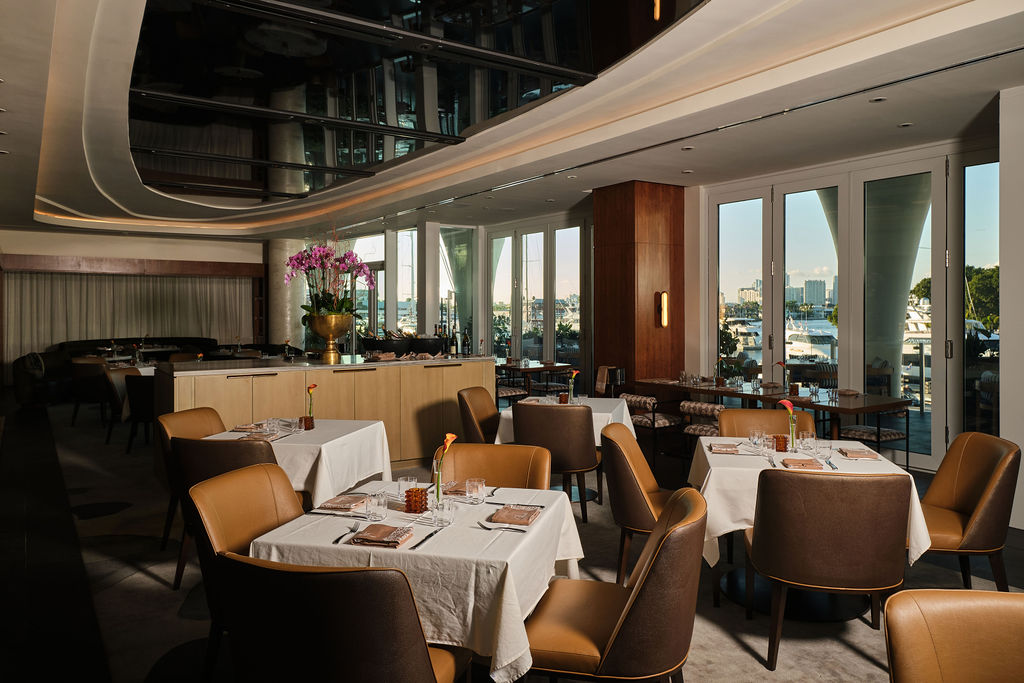 a restaurant with tables and chairs