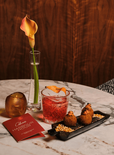 a table with a drink and food on it