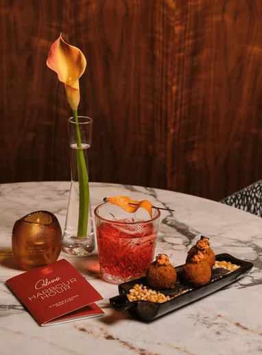 a table with a drink and food on it