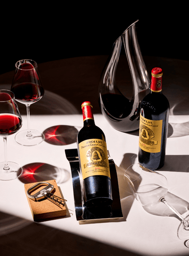 a group of wine bottles and glasses on a table
