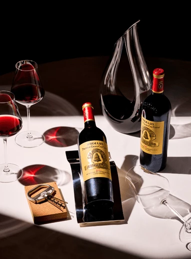 a group of wine bottles and glasses on a table