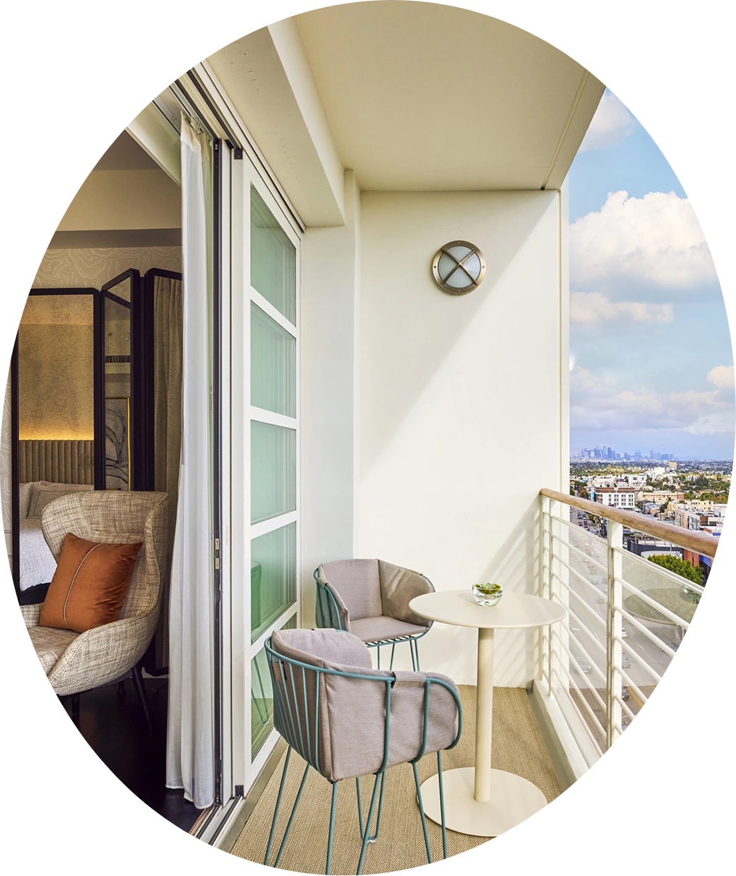 a balcony with chairs and a table