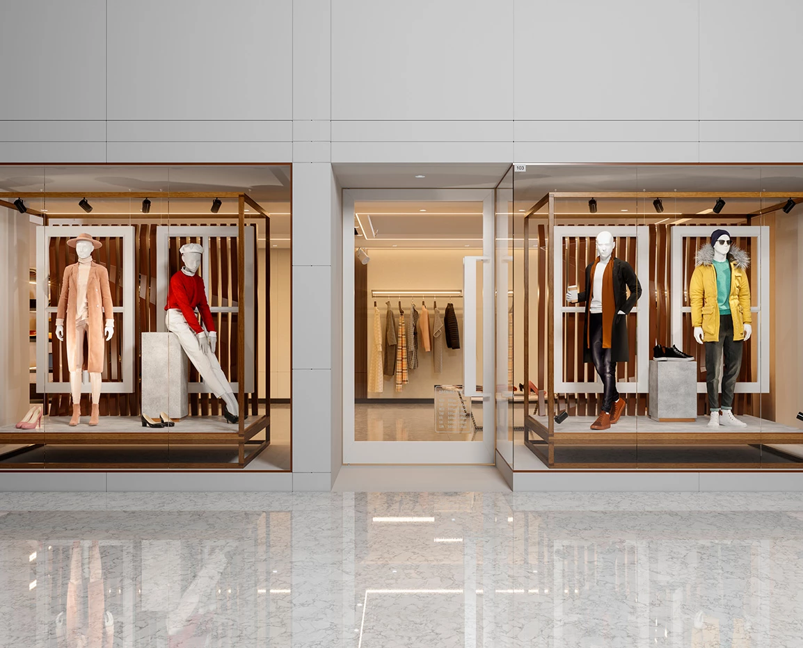 a storefront with mannequins in front of glass doors