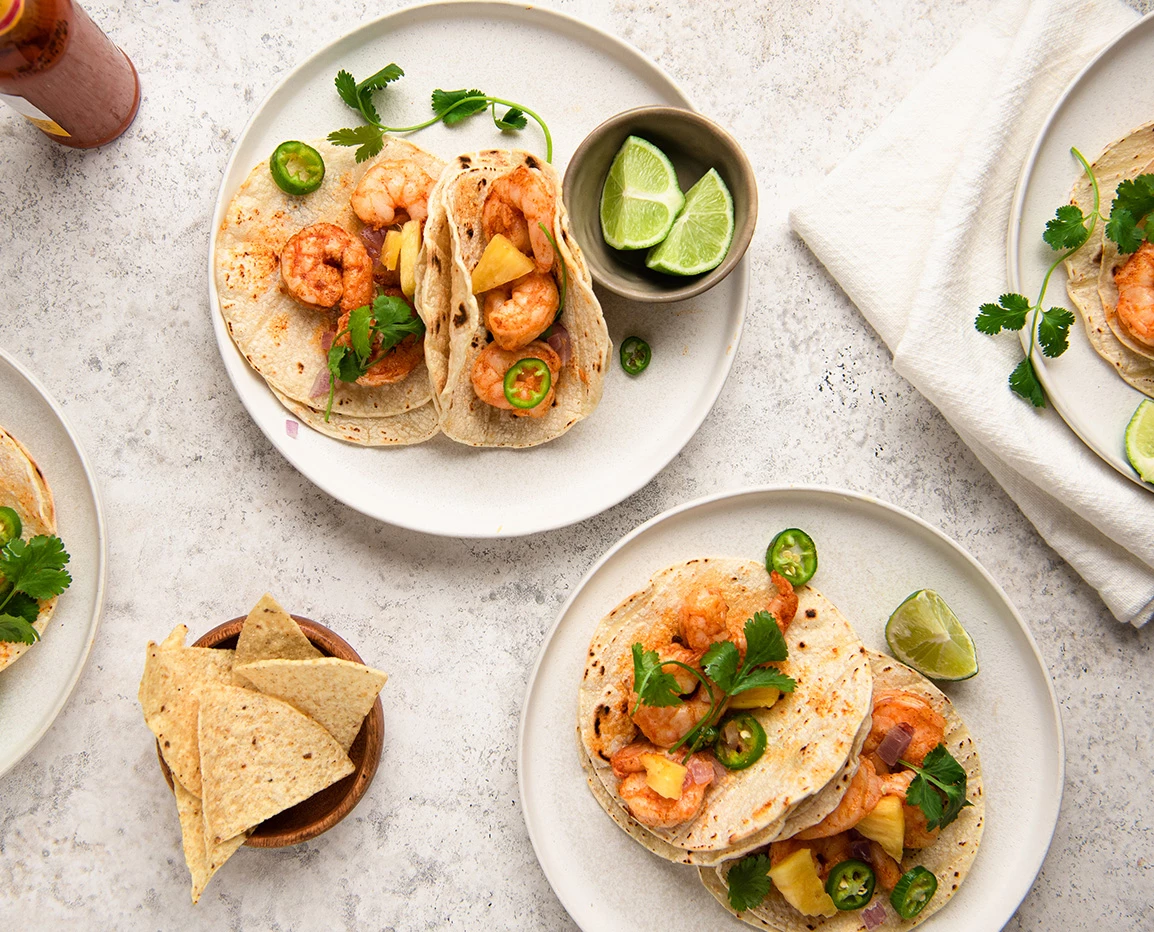 a plate of shrimp tacos