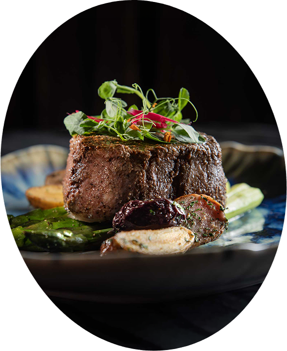 a plate of food with a black background