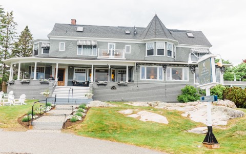 a house with a lawn and a sign