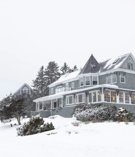 a house with snow on the ground
