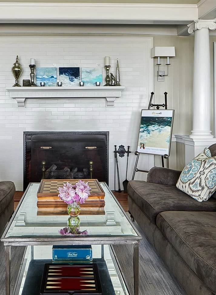 a living room with a fireplace Next