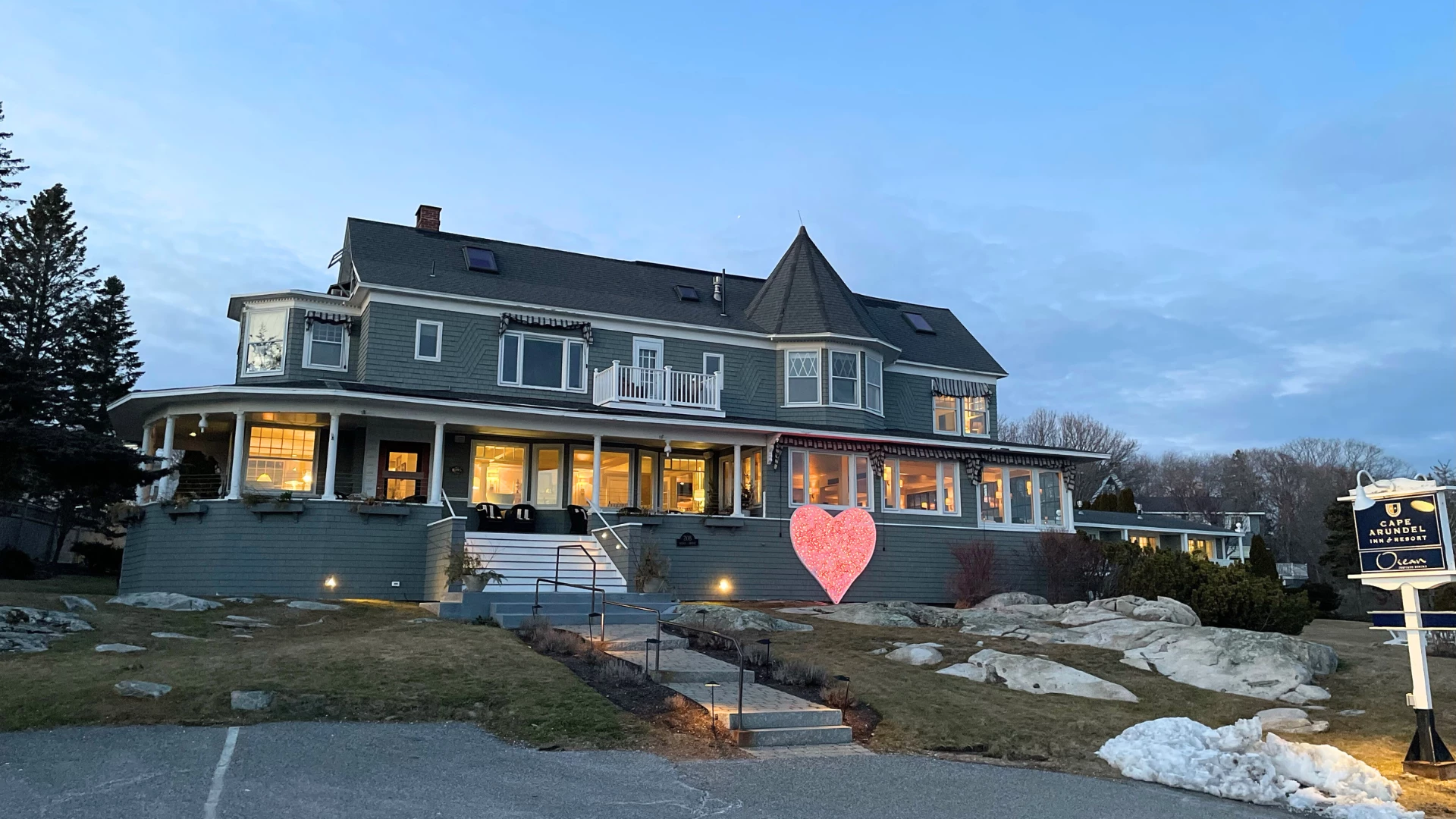 a large house with a large heart in the front