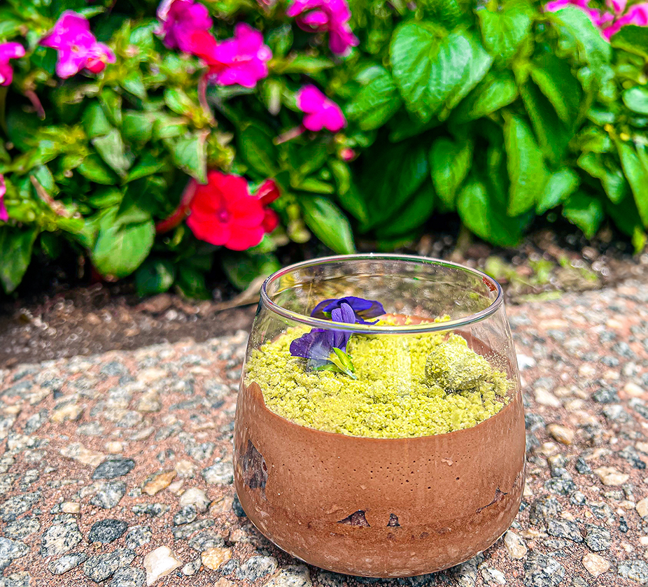 a glass with a dessert in it