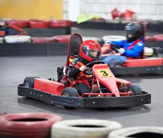 a group of kids in go karts