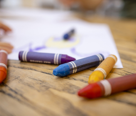 a group of crayons on a table