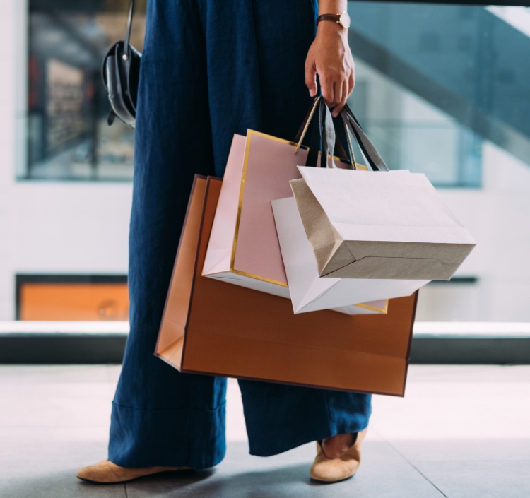a person holding shopping bags
