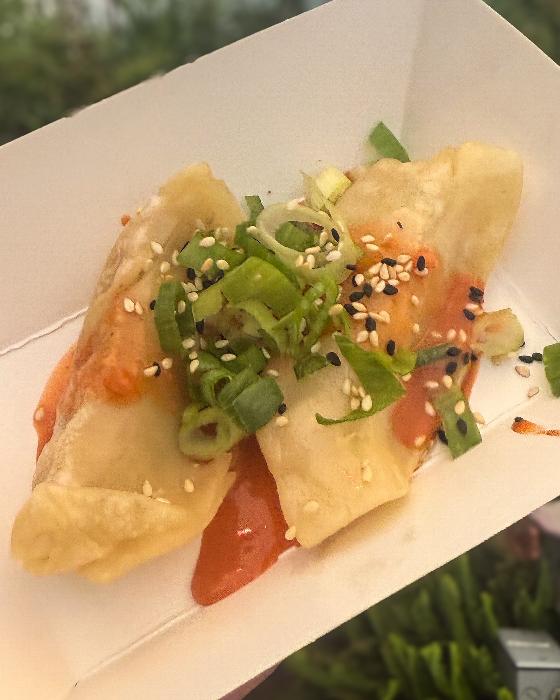 food in a box with sauce and vegetables