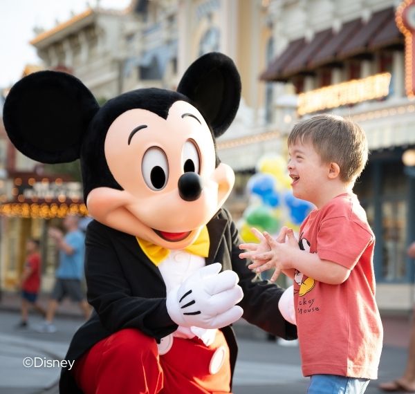 a boy in a garment with a mouse