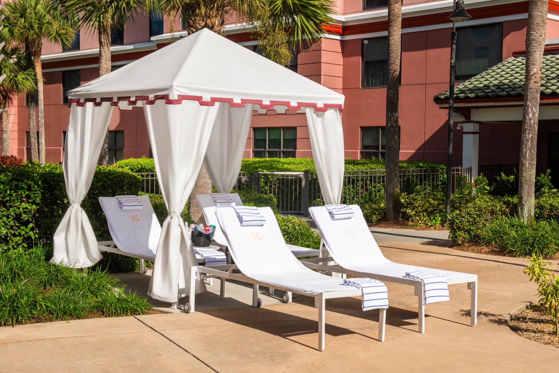 a group of lounge chairs outside