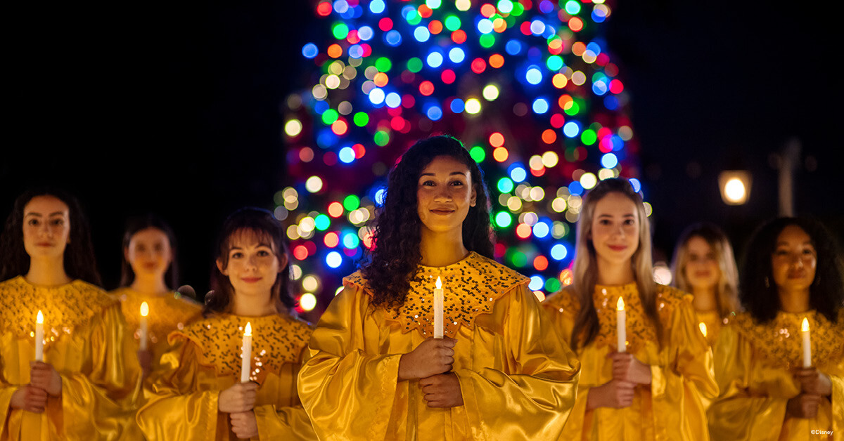 a group of women holding candles
