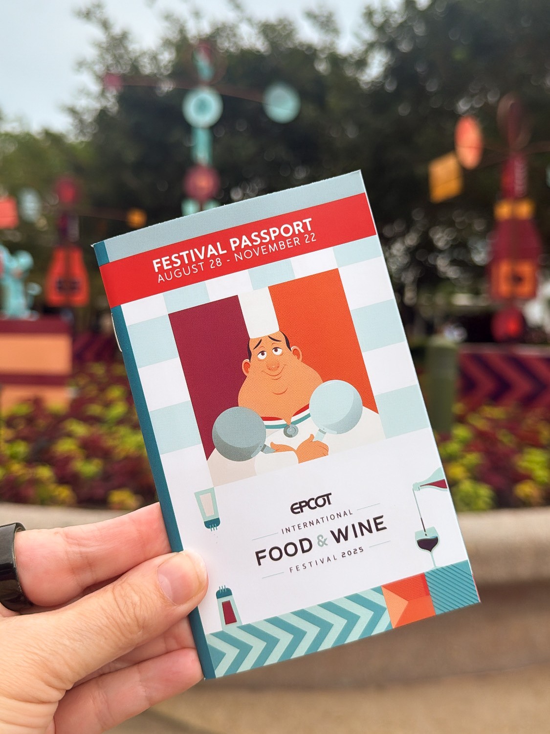 a hand holding a passport