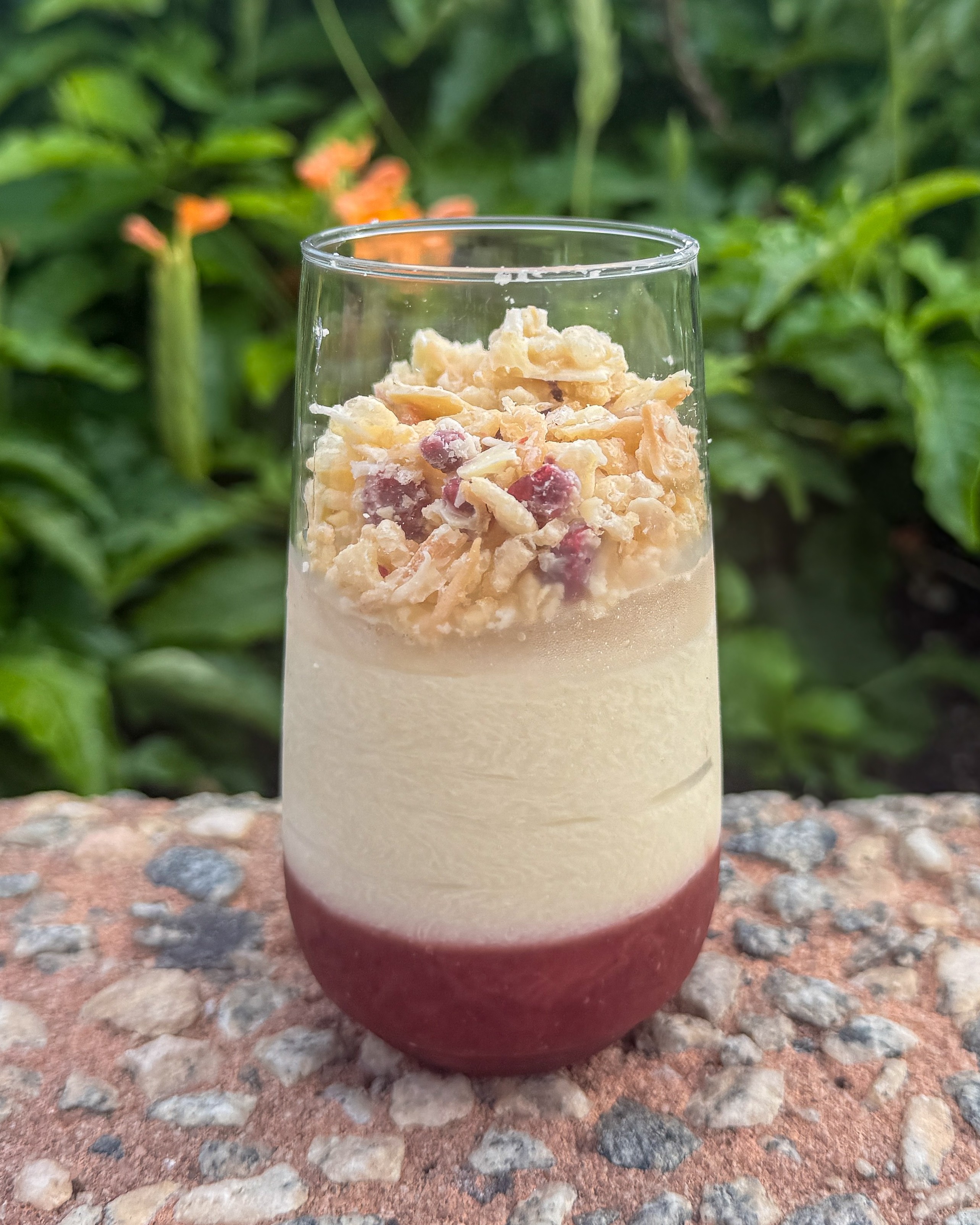 a glass with a dessert in it