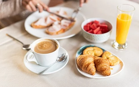 a table is filled with breakfast