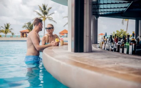 a man and woman in a pool
