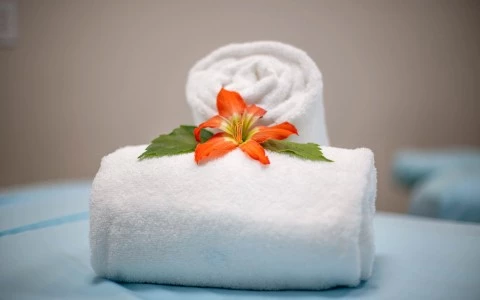 a white cake with a flower on top