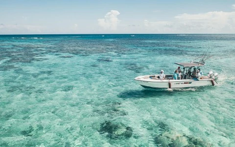 a boat with people on it in the ocean