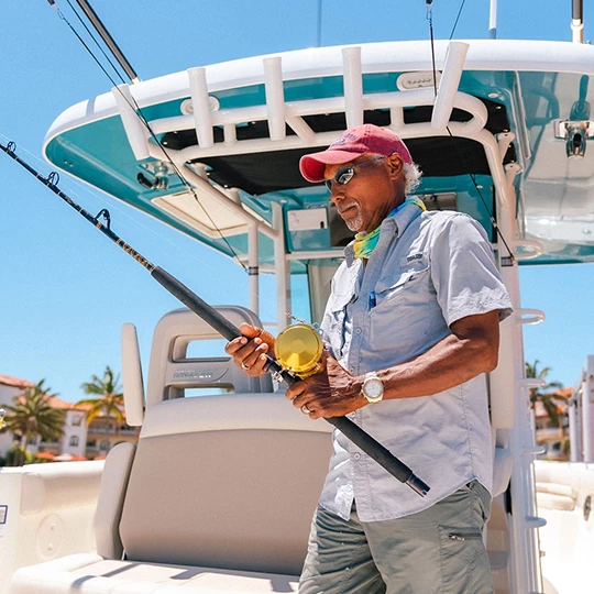 a man holding a fish