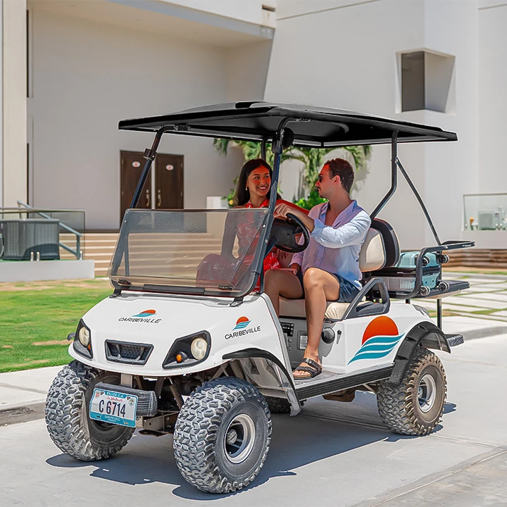 a couple of women on a golf cart