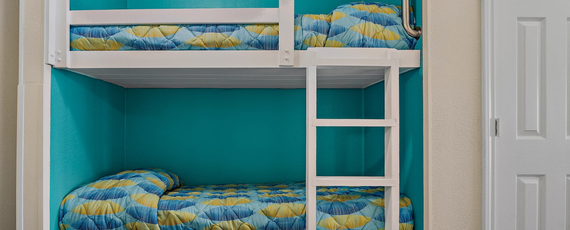 a bunk bed with a blue and yellow pattern