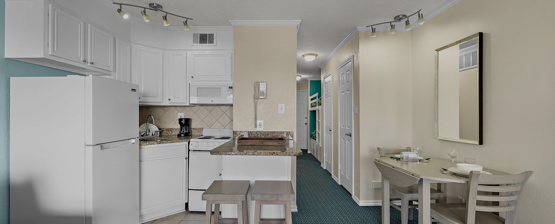 a kitchen with a telephone and a sink