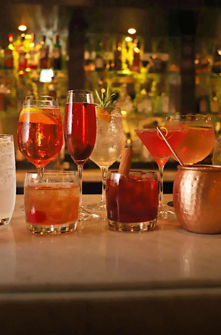 a group of glasses with liquid in them