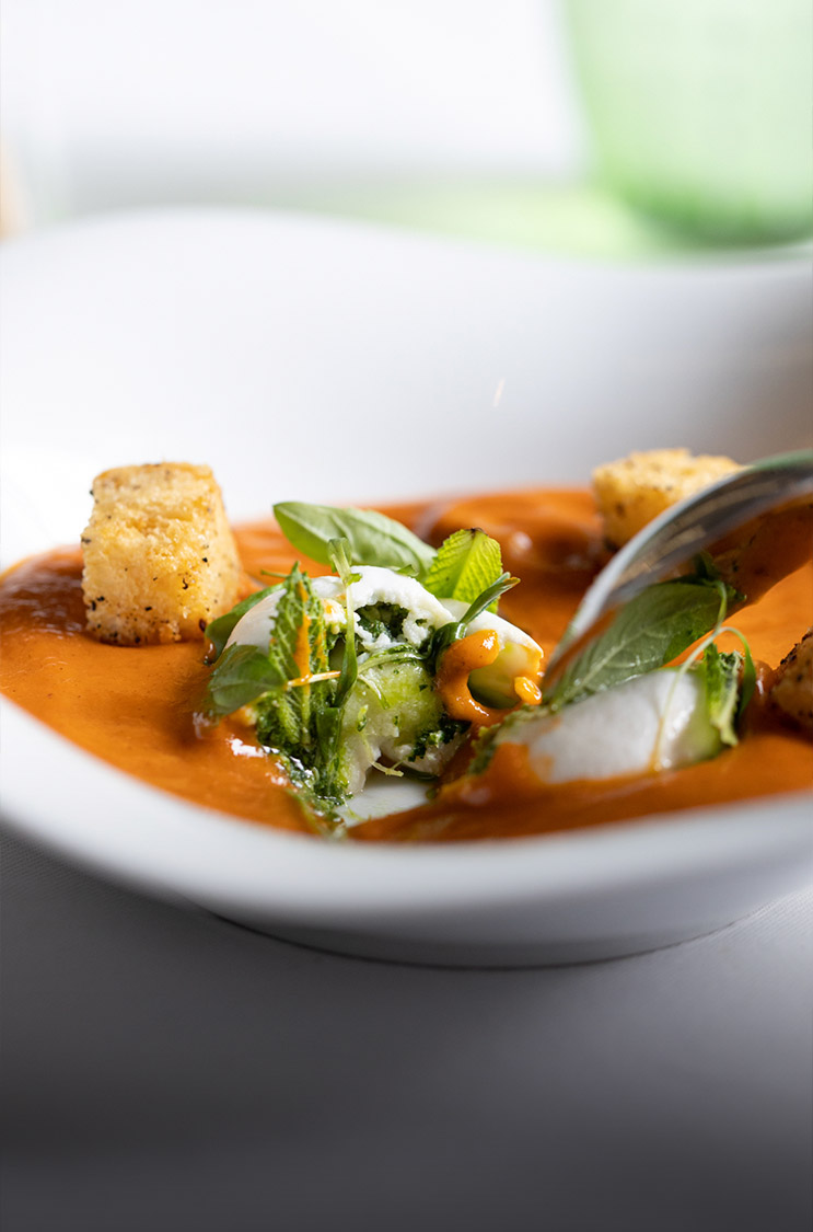 a bowl of soup and spoon