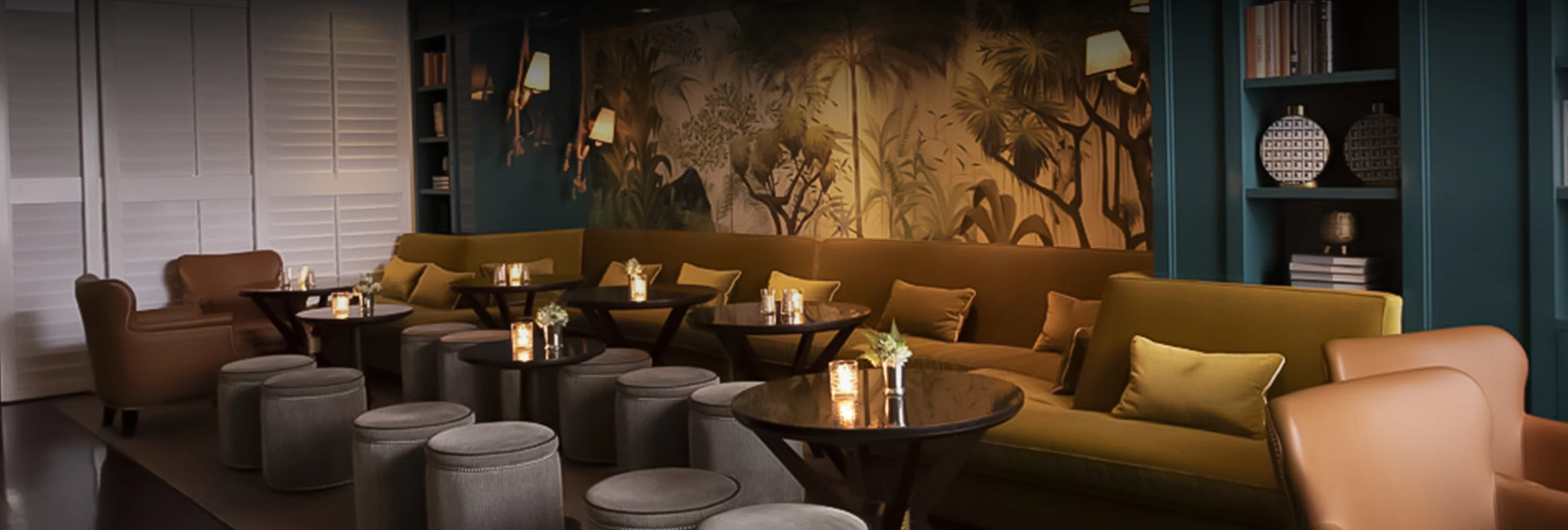 a room with a couch and chairs