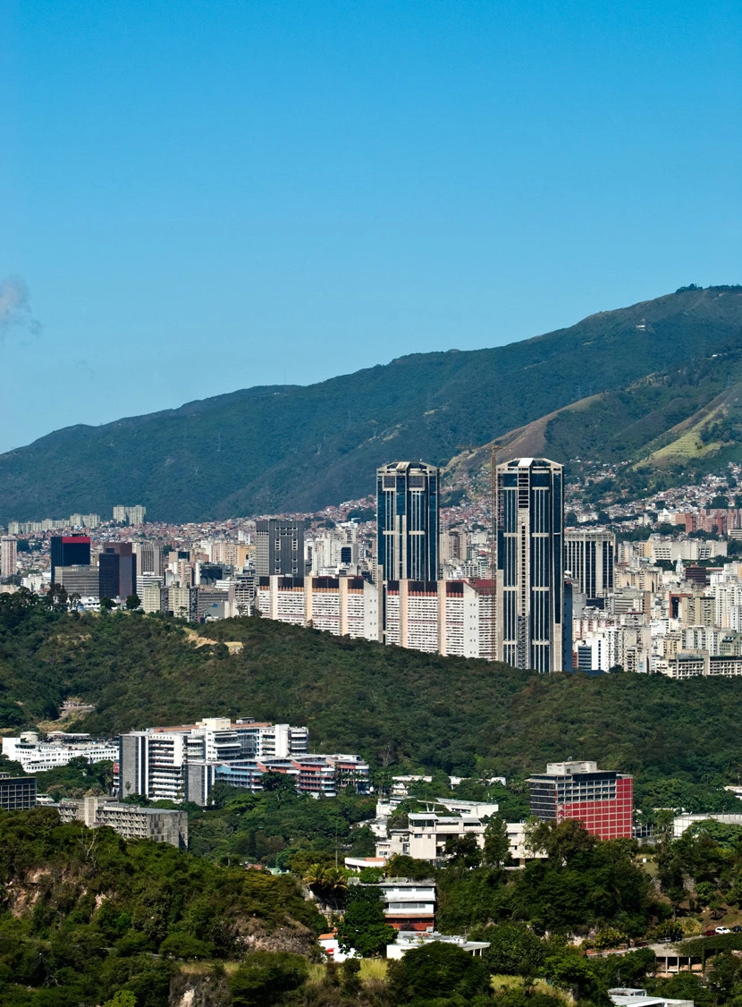 a city with a mountain in the background