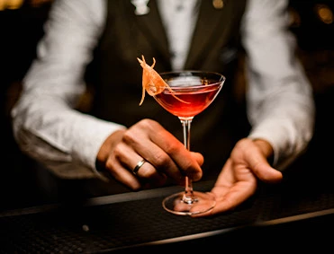 a person holding a drink