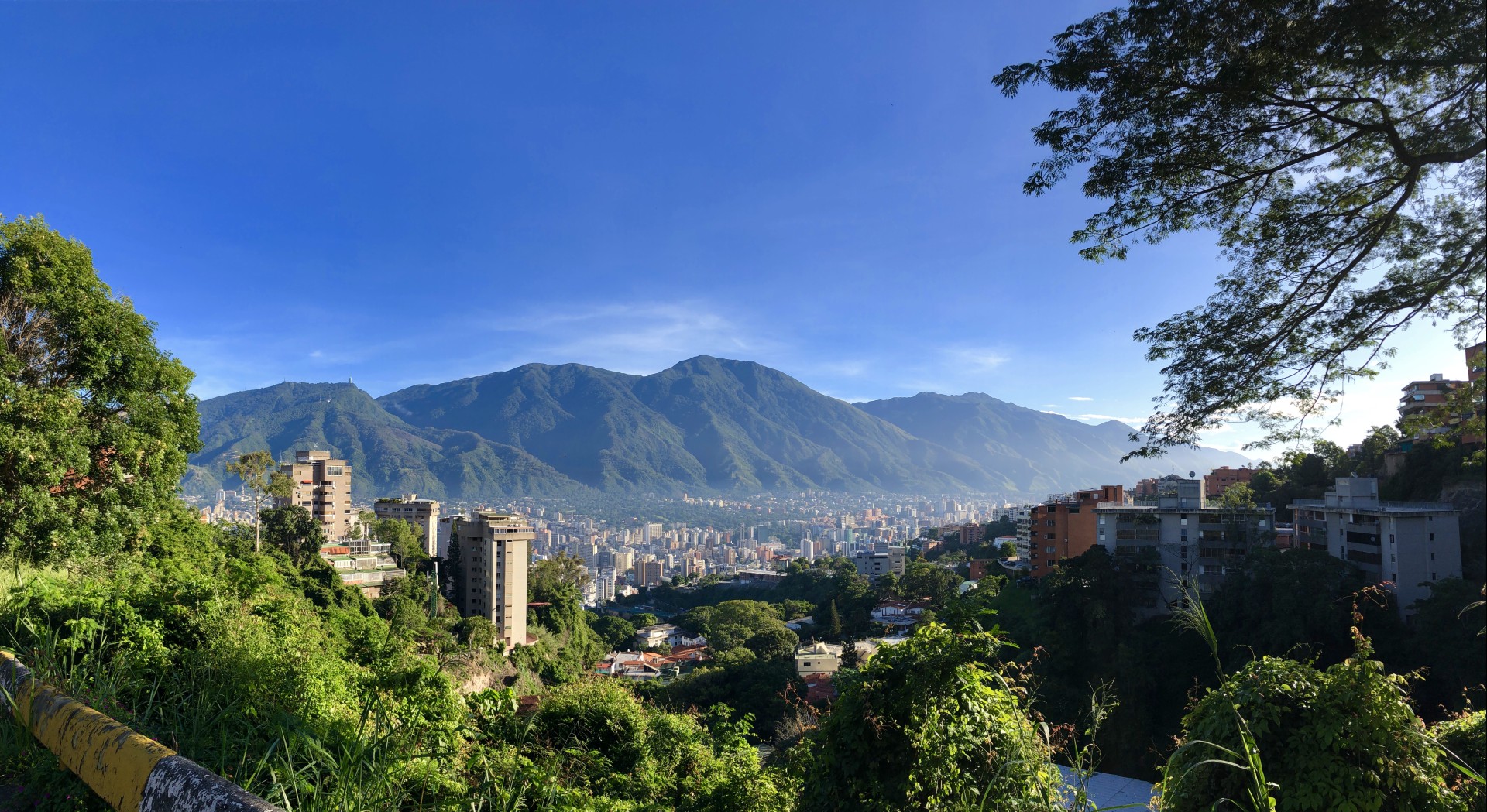 a city with mountains in the background