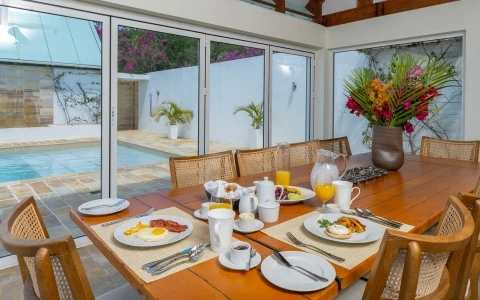 a table with plates of food and a glass door