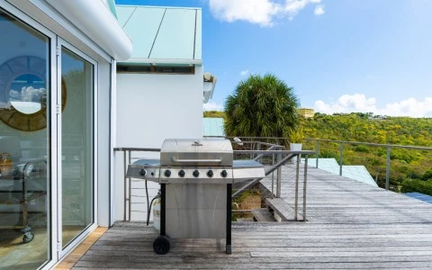 a barbecue on a deck