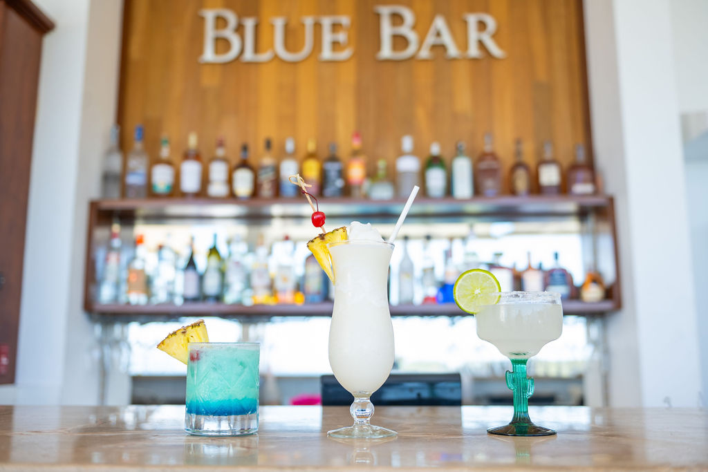 a group of drinks on a bar