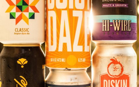 Six craft beer cans stacked on top of each other
