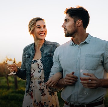 couple walking through a wine tour