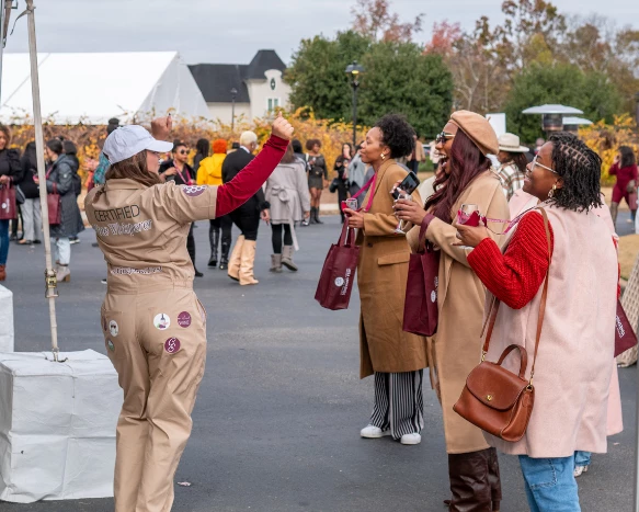 a group of women standing outside
