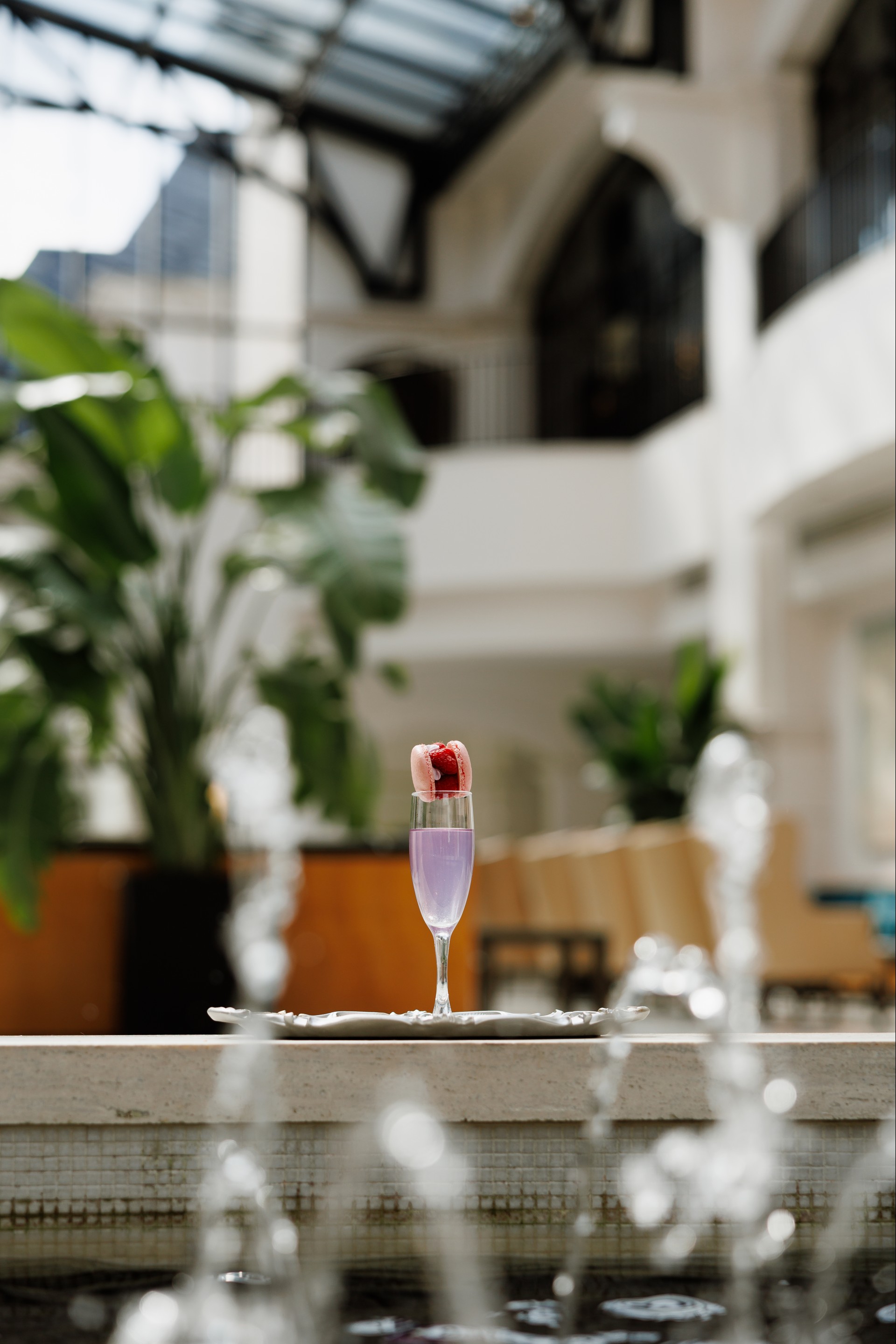 a glass with a strawberry on top of it