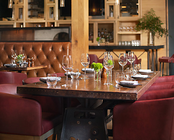 close up image of table with six red chairs