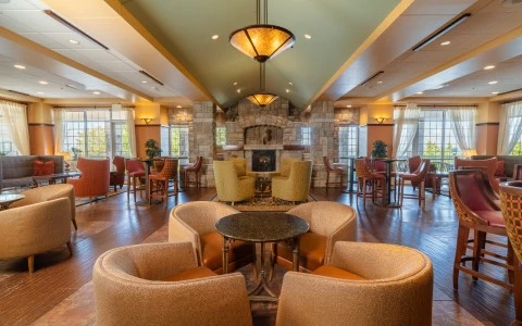 a room with chairs and a fireplace